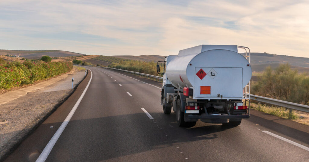 Truck with panels of dangerous goods for distribution of fuel for heating and small industries, circulating on the highway.